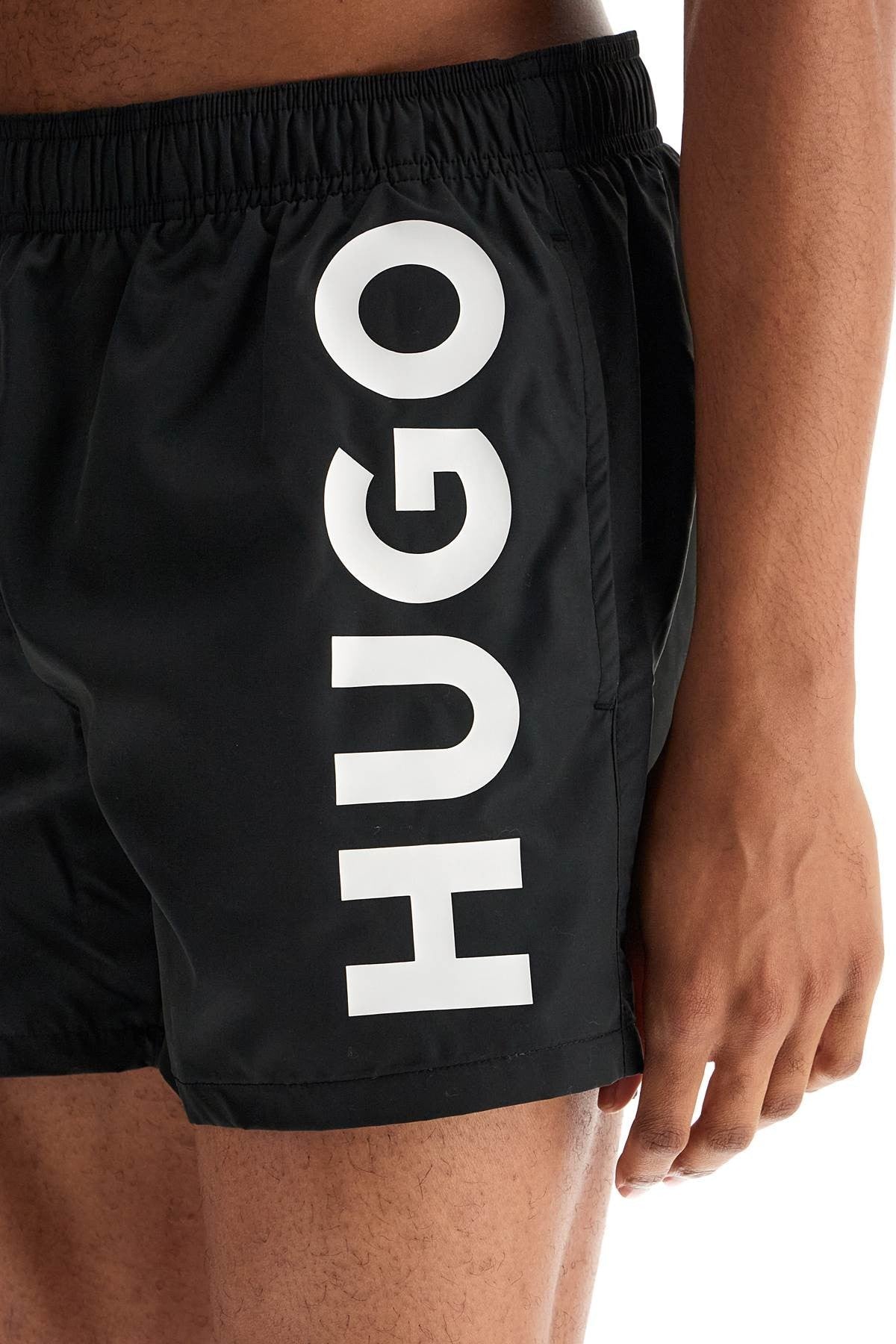 black swimsuit made of recycled polyester with quick-dry feature