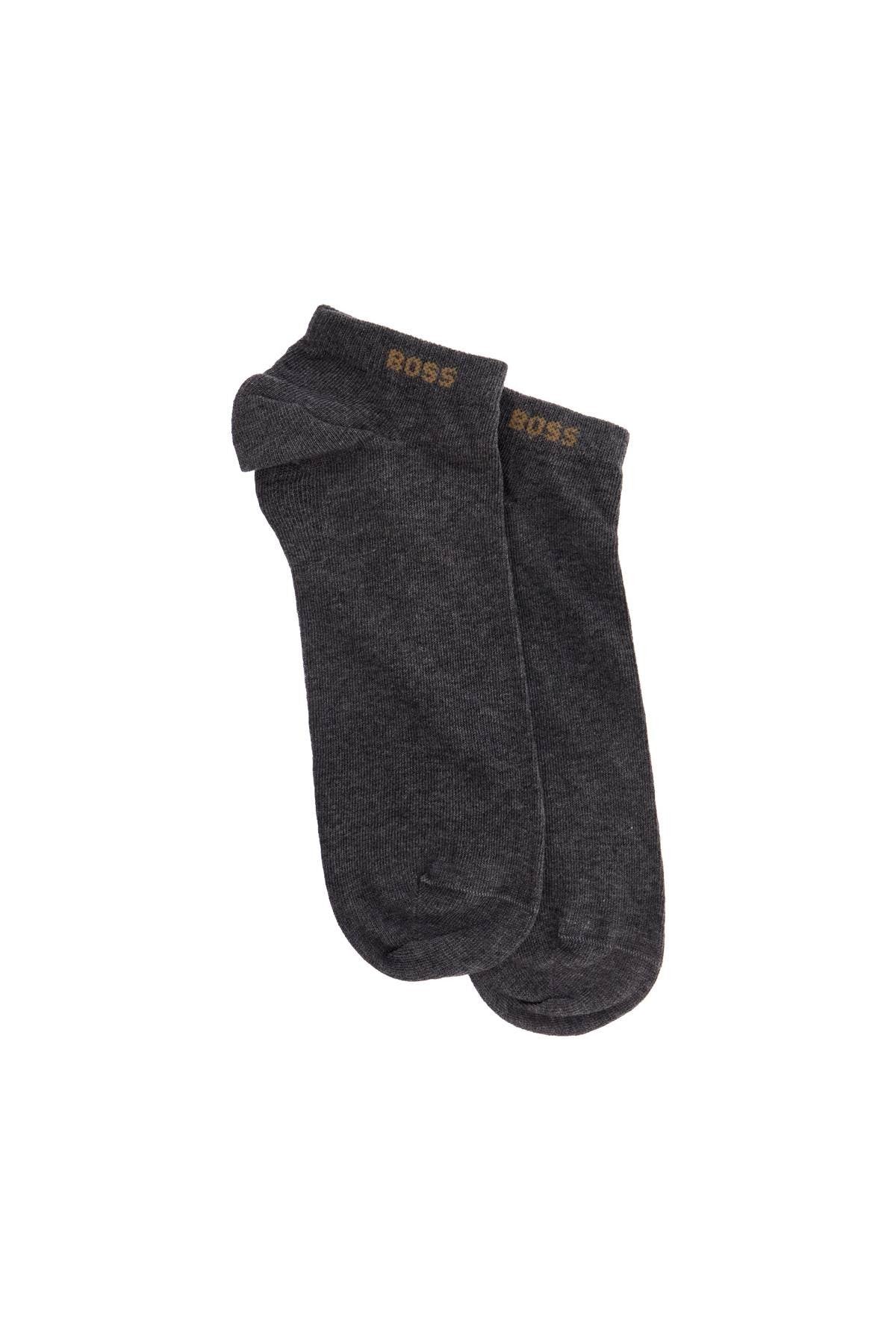 low-cut gray and white socks with gold logo and brown band