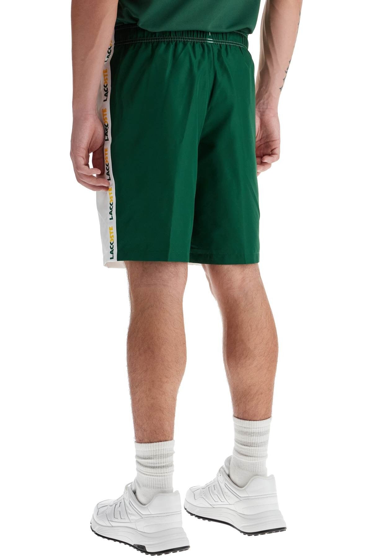 with logo on the bermuda shorts