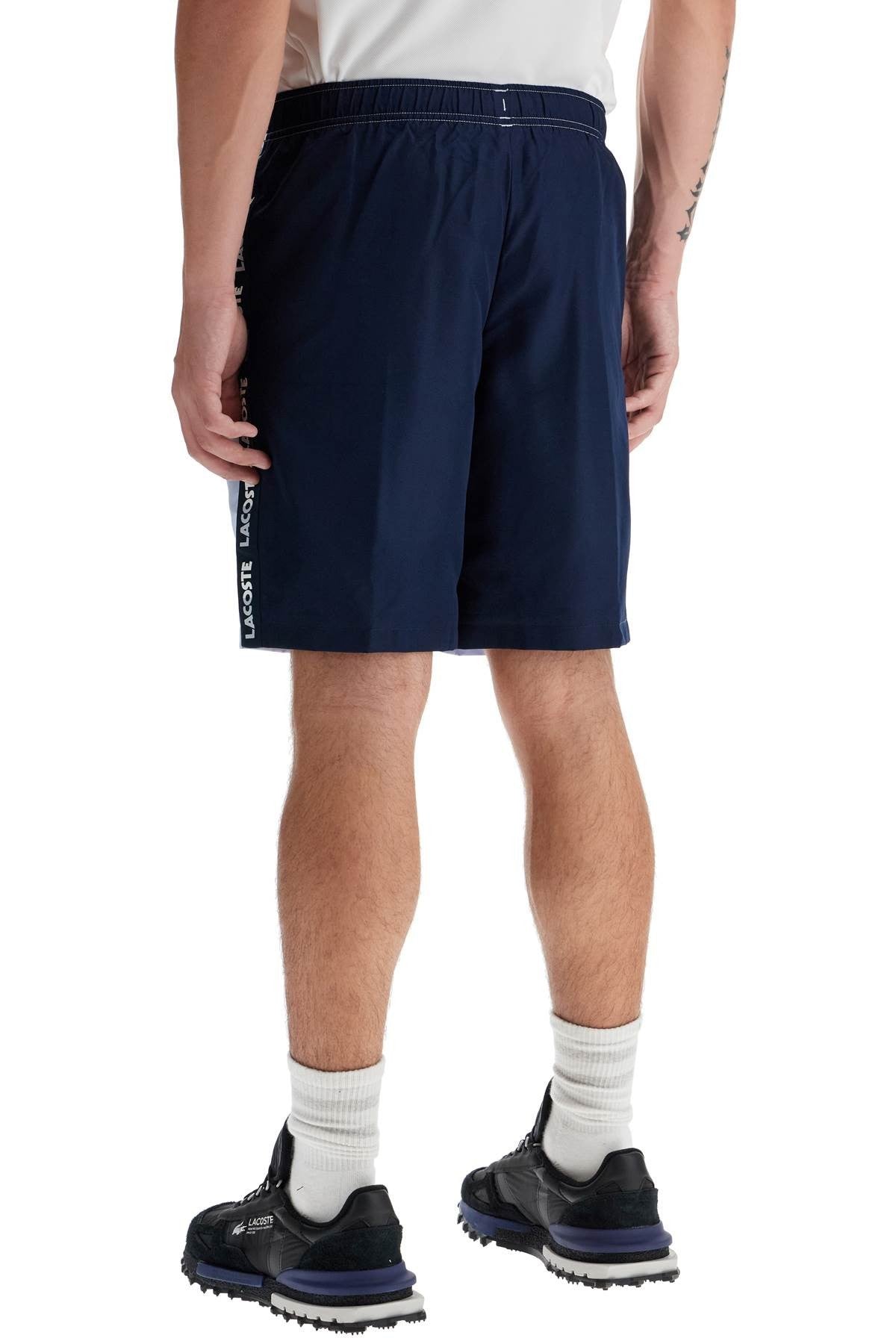 with logo on the bermuda shorts